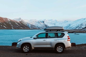 rental car in ICeland at a lake in winter