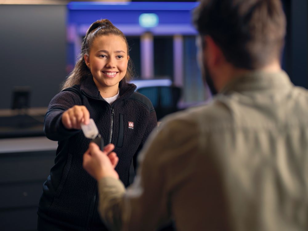 Blue car rental staff and customer