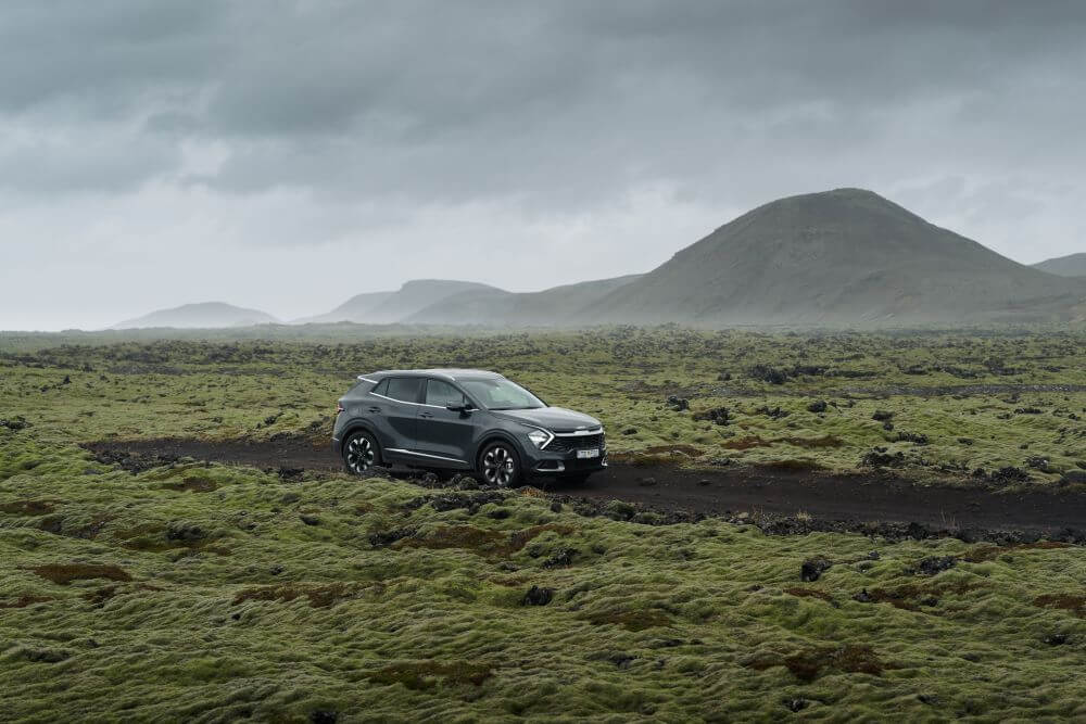 Rental vehicle in lava field spring iceland.
