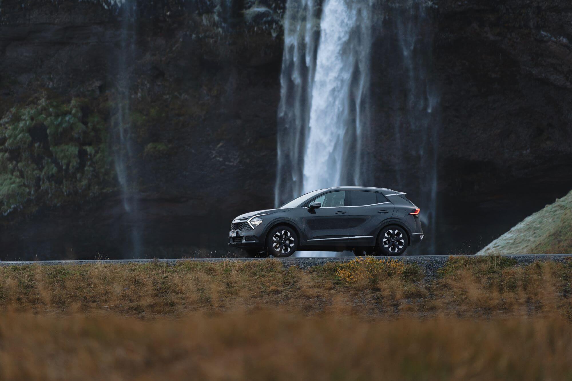 Rental car in Iceland at Seljalandsfoss waterfall.