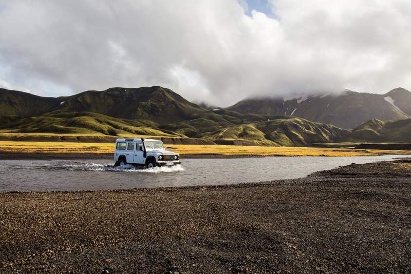 Land Rover Defender crossing a river in Iceland 