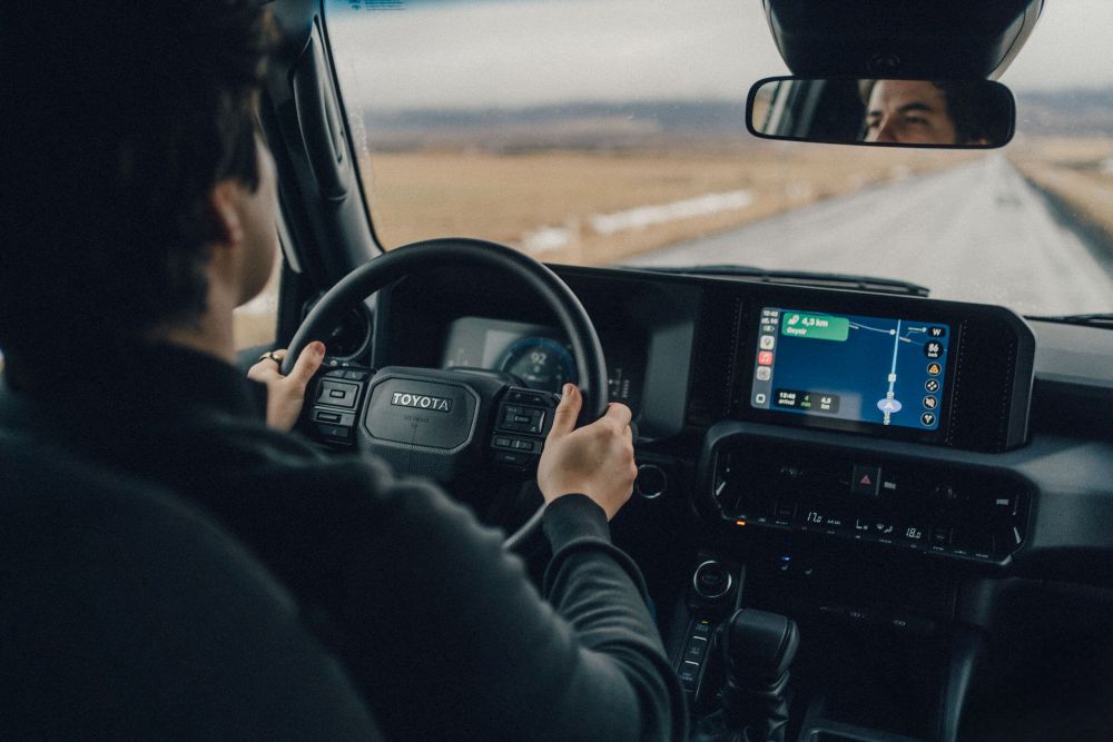 Man driving a Toyota Land Cruiser in Iceland,