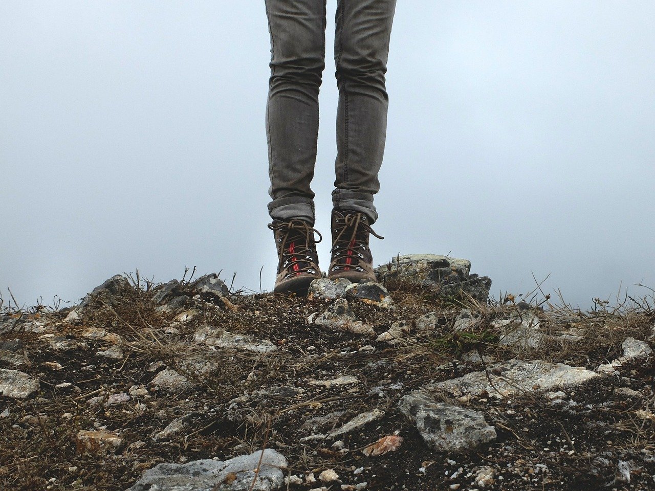Man stand on a lava rocks in a hiking boot