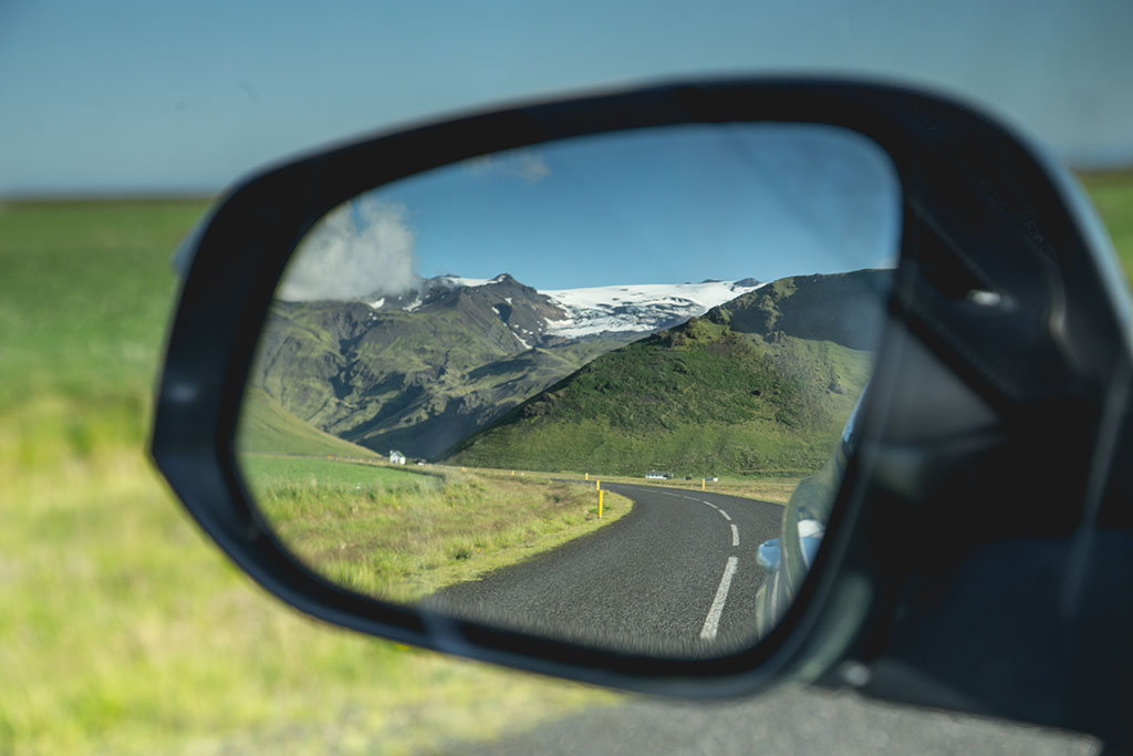 Icelandic road mirroring in a side mirror