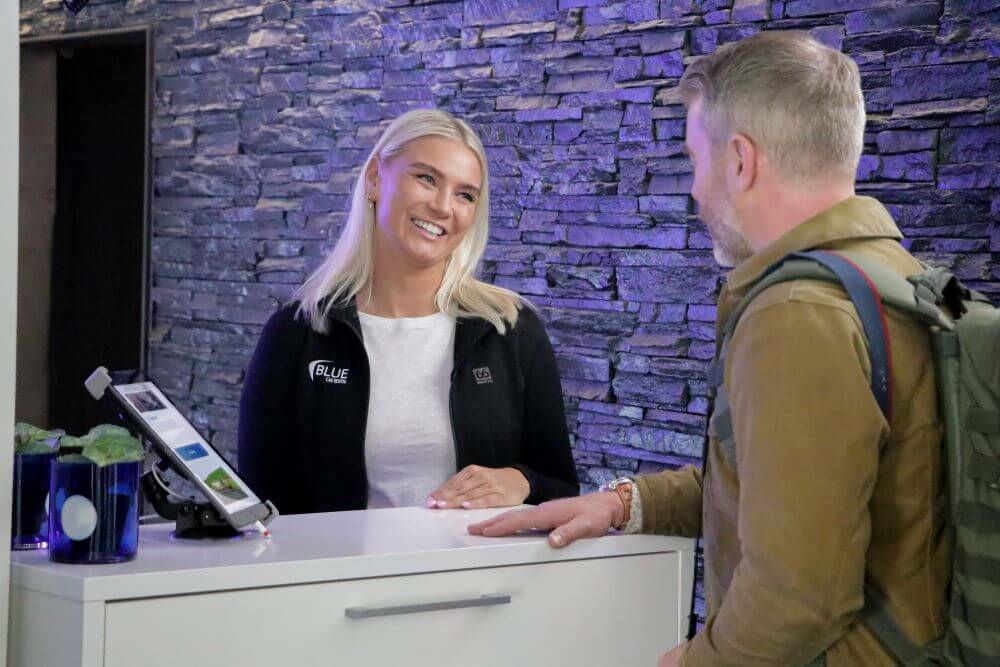 blue car rental staff information to customer.