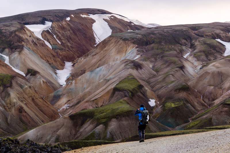 Person hiking and watching the nature in Landmannalaugar