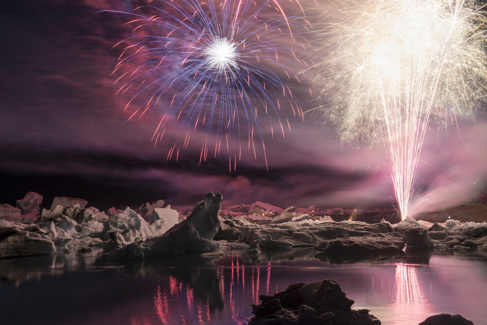 Firework show among icebergs at Ice lagoon Jokulsarlon, Blue Car Rental