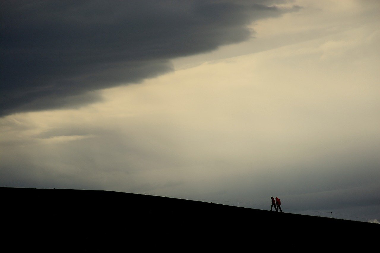 Two people hikinga inactive volcano in Iceland