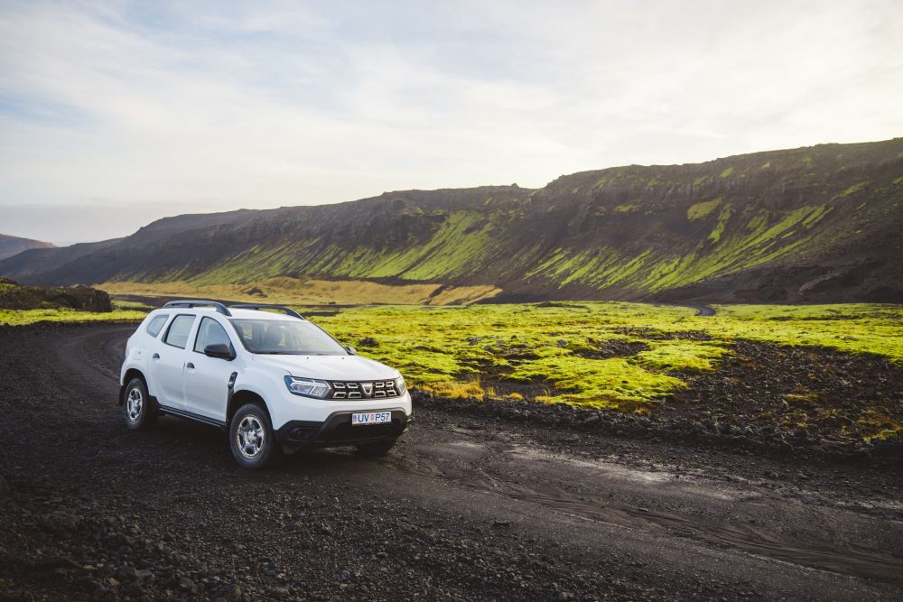 Dacia Duster driving on a F-road in Iceland highland.